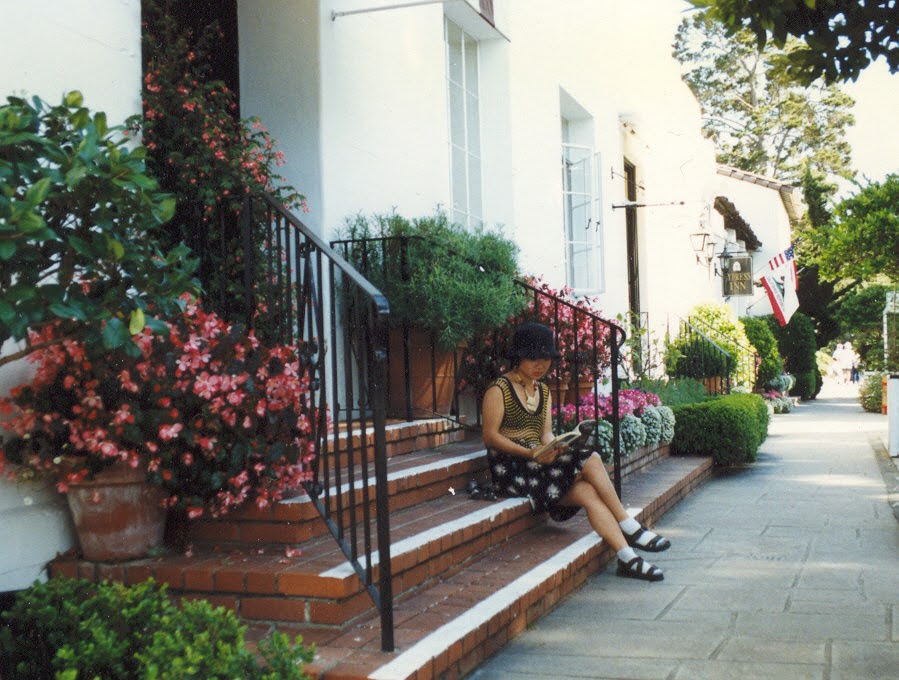 Annie Wang reading on the steps near Carmel during the Berkeley years
